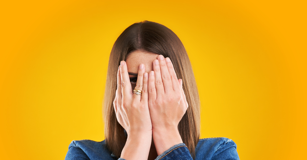 Woman hiding her face