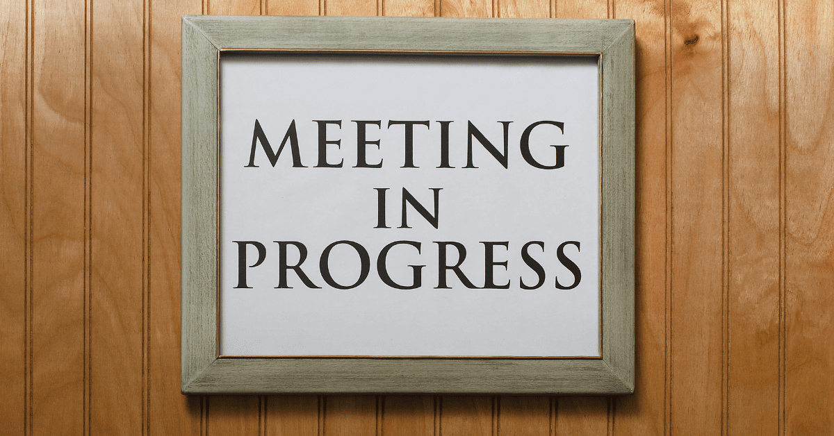 Meeting in Progress sign